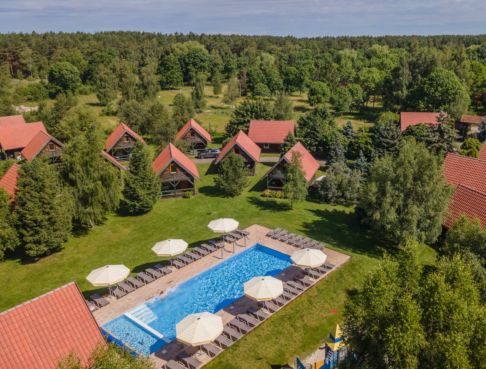 Pool and cottages from aerial view